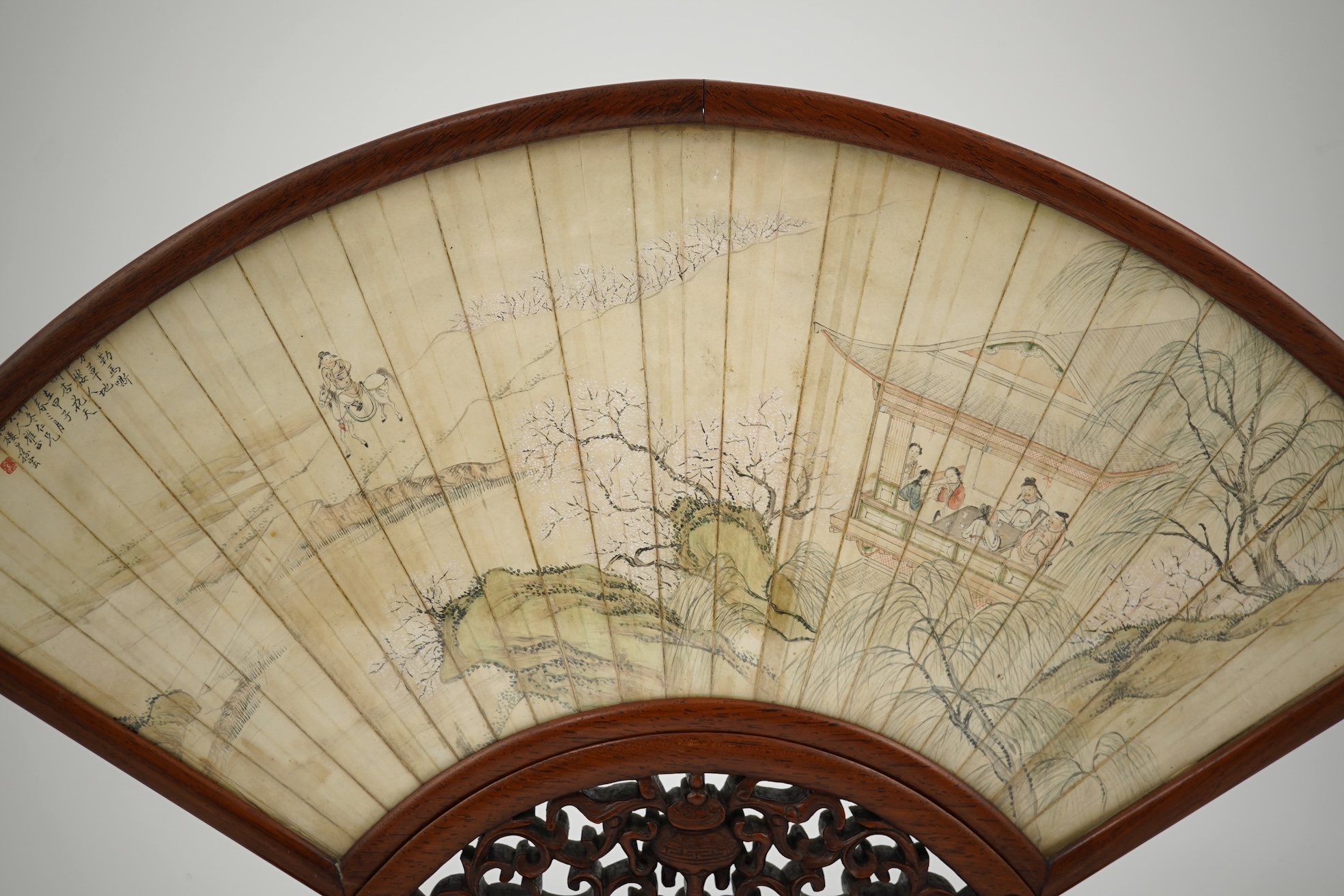 A Chinese painted leaf fan and hardwood stand, late 19th century
